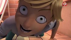 a cartoon character with big eyes and blonde hair is on the floor in front of a red brick wall