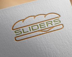 a close up of a logo on a piece of paper with the word sliders