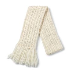 a white scarf with fringes on the ends and an open knitted design, against a white background