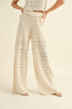 Create a buzz with these stunning crochet knit wide leg pants! Mix and match with the Dobie Ave Crochet Knit Tank or your favorite summer top <3 DETAILS:• 100% cotton• Elastic stretch waist with raw edge• Lined on top portion of pants• Hand wash• Model is in size small. She is 5' 7.5" | Bust: 175.3cm | Waist: 24" | Hips: 34" Luxury Summer Bottoms With Cutwork Hem, Cheap Lace Bottoms For Summer, Luxury Wide Leg Pants With Lace Trim, Luxury Scalloped Lace Bottoms For Women, Luxury Fitted Bottoms For Vacation, Luxury Sheer Summer Pants, Luxury Lace Elegant Bottoms, Cheap Summer Bottoms With Lace Trim, Cheap Feminine Bottoms With Lace Trim