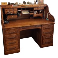 an old wooden desk with many drawers