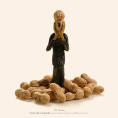 a small figurine is surrounded by peanuts