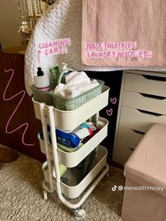 a white cart filled with lots of cleaning supplies on top of a carpeted floor