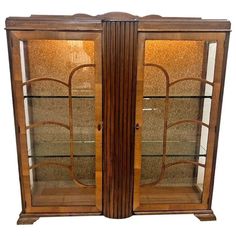 two wooden display cases with glass doors