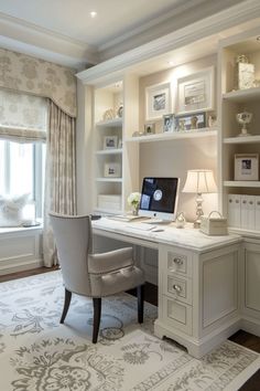 a home office with built in shelving, desk and chair next to a window