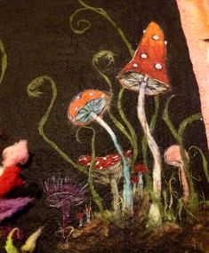 an image of a painting on the ground with mushrooms and plants painted on it's surface