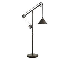 a lamp that is sitting on top of a stand with the words,'warren pulley task floor lamp '