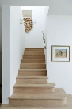 the stairs are made of wood and have been painted white