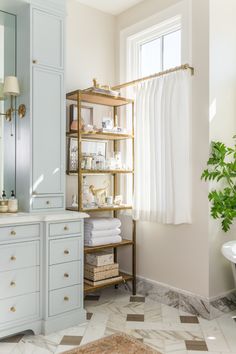 the bathroom is clean and ready to be used as a storage area for towels or other items