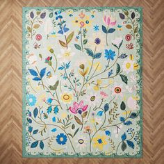 a rug with flowers and leaves on it