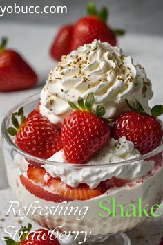 a bowl filled with whipped cream and strawberries