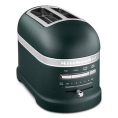 a green toaster sitting on top of a counter