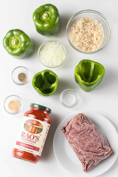 ingredients to make stuffed peppers laid out on a white surface including meat, seasoning and pepper