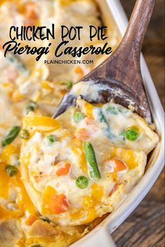 chicken pot pie casserole in a white dish with a wooden spoon