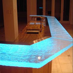 an illuminated table in the middle of a room