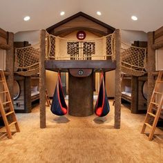 a room filled with bunk beds and ladders