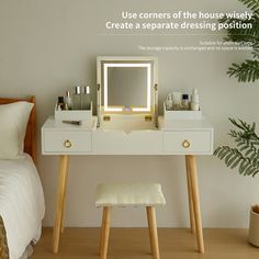 a bedroom with a bed, mirror and stool in front of the dresser is shown