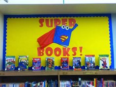 the bookshelves are full of children's books and there is a sign that says, super books