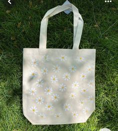 Bag with lots of daisies. - 100% cotton - Long shoulder straps - Washable at 30-40 degrees, delicate wash, easy care (turn inside out) Trendy Cotton Bags With Floral Print, Trendy Cotton Canvas Bag For Spring, Eco-friendly Cotton Bags For Spring, Everyday Cotton Flower-shaped Shoulder Bag, Casual Cotton Flower-shaped Bag, White Canvas Bag For Spring, Cotton Flower-shaped Shoulder Bag For Everyday Use, Flower-shaped Cotton Shoulder Bag For Everyday Use, Flower Shaped Cotton Shoulder Bag For Everyday Use