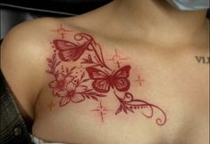 a woman's chest with butterflies and flowers on it