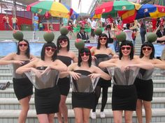 a group of women dressed up in costumes