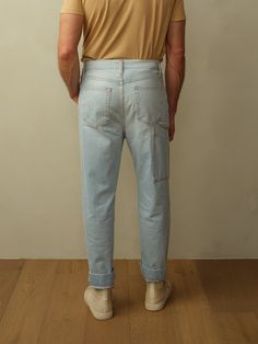 Fit: Mid-rise with a Carrot Leg. Models are wearing size 31. Fits true to size. Material: 10oz Japanese Denim. 100% BCI Cotton. Eco Brass Buttons. Eco-Wash, using 70% less water. Care: Machine wash cold with like color. Tumble dry low. Do not bleach. Cool ironing. Origin: Made in Los Angeles, CA Denim Workwear, Brass Buttons, Japanese Denim, How To Look Classy, Denim Jean, Denim Jeans, Mid Rise, Work Wear, Bleach