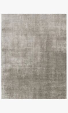 an area rug that has been made in grey tones