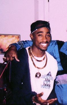 two young men sitting on a couch posing for the camera