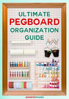 the ultimate pegboard organization guide is displayed in a wooden frame with scissors and thread