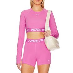 Nike Pro 365 2 Pc Set Size X-Large Cropped Long Sleeve Top & Short Color: Playful Pink & White Brand, New W/Tags Item Sold As A Set Top X-Large Product Details 83% Polyester, 17% Spandex Made In Vietnam Machine Wash Wide Logo Band Thumbhole Sleeves Jersey Fabric Shorts X-Large Product Details 78% Polyester, 22% Spandex Made In Cambodia Machine Wash Pull-On Styling With Elastic Waistband Nike Logo At Waistband And Hem Shorts Measure Approx 12" In Length Crop Long Sleeve, Cropped Long Sleeve Top, Cropped Long Sleeve, White Brand, Shorts Athletic, Nike Pros, Nike Shorts, Athletic Shorts, Nike Logo