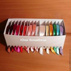 the box is full of different colored ribbons