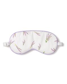 a sleeping mask with lavenders on it and the eye cover is made out of white fabric