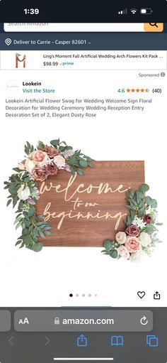 the wedding sign is displayed on an iphone screen, with flowers and greenery around it