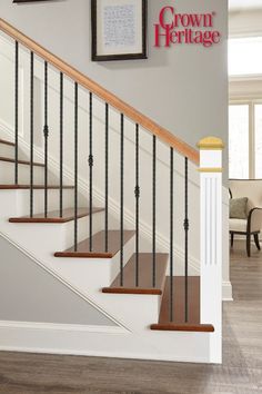 the stairs in this house are made of wood and metal, with handrails