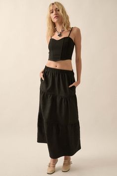 Textured maxi skirt. Tiered ruffle design. Wrinkle-texture fabric. Elastic waist. Side pockets. Ankle length. Relaxed fit. 100% Polyester. Imported. Designed in LA. Model wears size S. Skirt Tiered, Ruffle Maxi Skirt, Ruffle Design, Texture Fabric, Skirt Maxi, Vintage Canvas, Iron Decor, Layered Look, Ankle Length