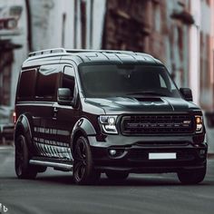 a black van is parked on the street