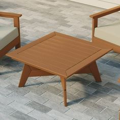 three chairs and a coffee table sitting on a brick patio with tile flooring in the background