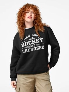 a woman with red hair wearing a black hockey sweatshirt