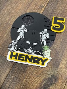 the number five sticker is next to a darth vader mask and star wars characters