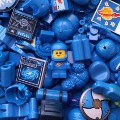 a pile of blue legos and other toys