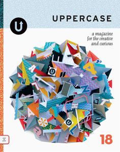 a magazine cover with an image of a bunch of origami pieces on it