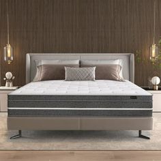 an image of a bedroom setting with mattresses and pillows on the bed side table