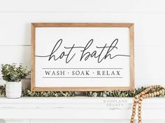 a sign that reads, do it bath wash soak relax on top of a mantle