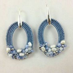 two pairs of blue and white beaded hoop earrings with pearls on each earring