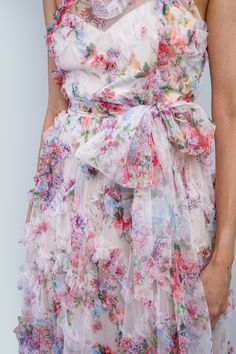 Enhance any special occasion with our Floral Ruffle Trim Halter Gown. The mock crew neck and fitted flare style create an elegant silhouette. The sheer floral tulle print and ruffle detail add a touch of romance, while the matching tulle belt cinches at the waist for a flattering fit. Perfect for summer weddings, wedding parties, or cocktail events. Size & Fit Model Measurements (Model is wearing Size S) Bust: 33" Waist: 26" Hips: 37" Height: 5’8" Bridgerton Garden, Summer Mother Of The Bride Dresses, Dresses Ruffles, Summer Wedding Guest Dress, Spring Summer Wedding, Summer Wedding Guests, Halter Gown, Floral Gown, Wedding Parties