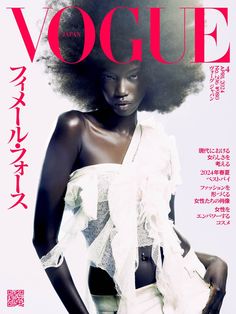 a woman with an afro is featured on the cover of a magazine, wearing a white top