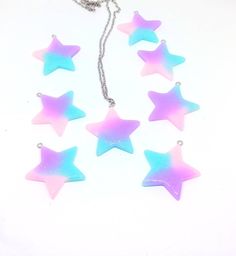 Check out this beautiful galaxy style star necklace! You will receive one necklace (unless you order more) the picture is just a heads up that these are allllllllllllllllllllllllll one of the kind and the one on the chain might not be one you get, you might get another! Each necklace is an absolute galaxy inspired pastel dream of blue and pink and purple with a heaping helping of silver glitter. Also treat this like a Mogwai and don't get it wet or it might truly turn into a gremlin; okay not re Resin Kawaii, Beautiful Galaxy, Kawaii Fairy, Wolf Pendant Necklace, Galaxy Style, Acrylic Ideas, Japanese Pearls, Galaxy Fashion, Rave Accessories