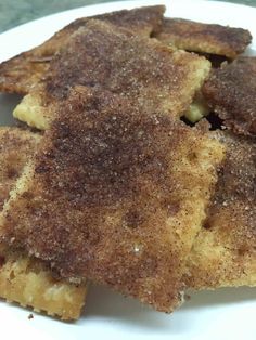 several pieces of food on a white plate with some brown sugar sprinkles