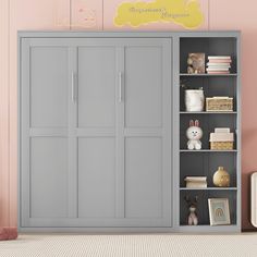 a gray bookcase with doors and shelves in a child's room