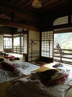 a room with tatami mats and open windows